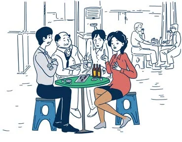 Des collègues participent à un dîner d'entreprise.